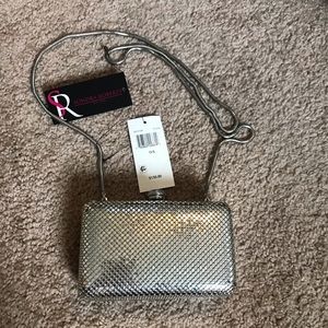Sondra Roberts silver clutch with long removable strap
